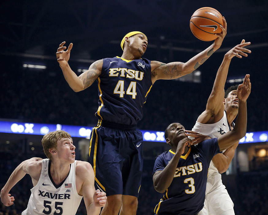 SSports - HM   - East Tennessee State guard Andre Edwards (44) pulls in a defensive rebound in the first half against the Xavier Musketeers at the Cintas Center in Cincinnati. (Sam Greene / Cincinnati Enquirer)